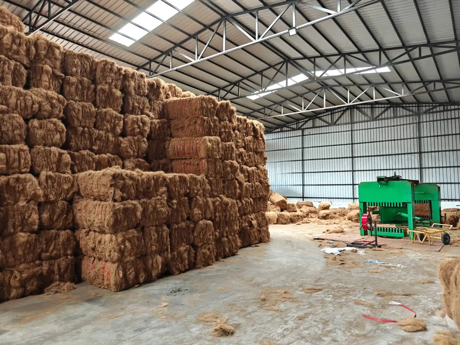 Compressed coir fibre bales stacked inside Hexagro's warehouse for dispatch